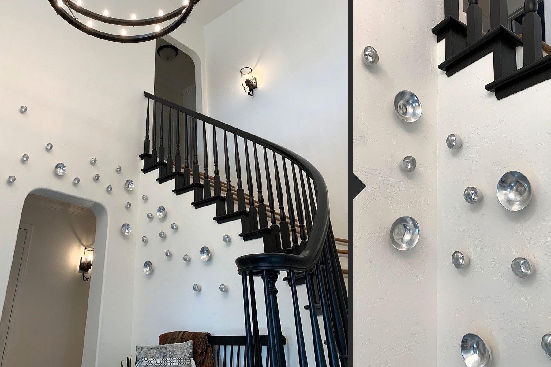 Silver Seed and Full Moon Wall Play™ in a home on a white wall under a stair with black bannister.